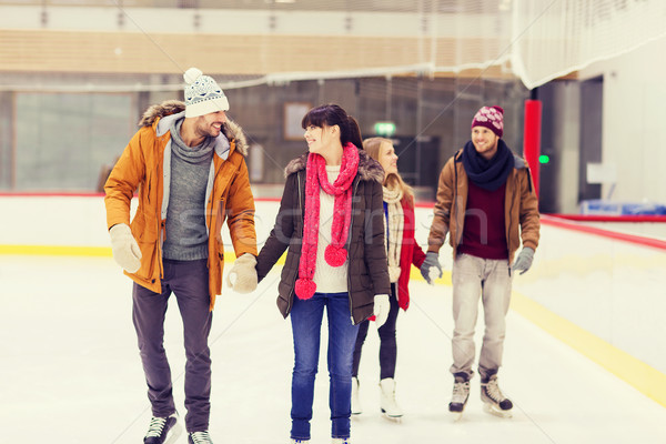 Stock photo: happy friends on skating rink