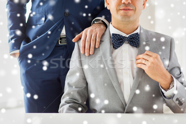 close up of male gay couple with wedding rings on Stock photo © dolgachov
