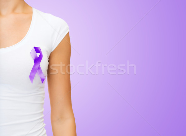 close up of woman with purple awareness ribbon Stock photo © dolgachov