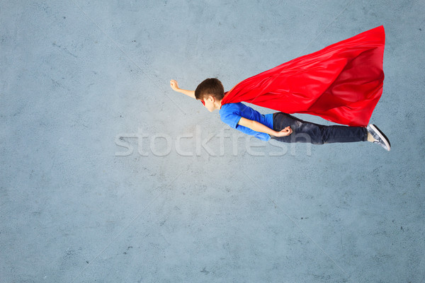 Erkek kırmızı süper kahraman maske uçan hava Stok fotoğraf © dolgachov