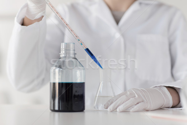 close up of scientist making test in lab Stock photo © dolgachov