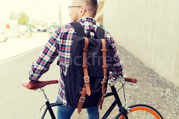 Homme fixé engins vélo sac à dos [[stock_photo]] © dolgachov