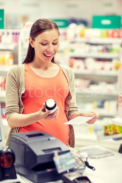 happy pregnant woman with medication at pharmacy Stock photo © dolgachov