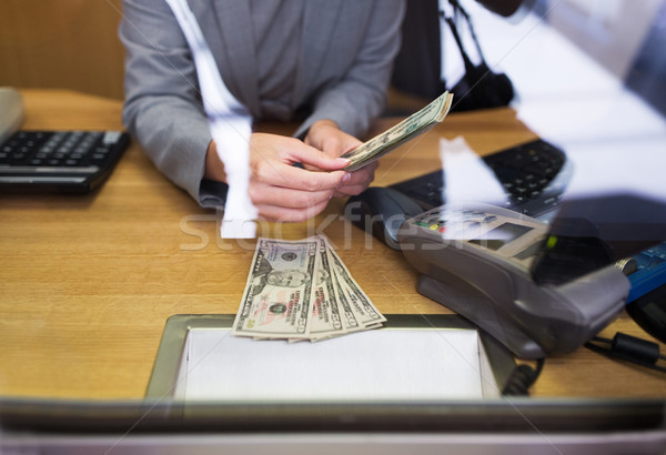 clerk giving cash money to customer at bank office Stock photo © dolgachov