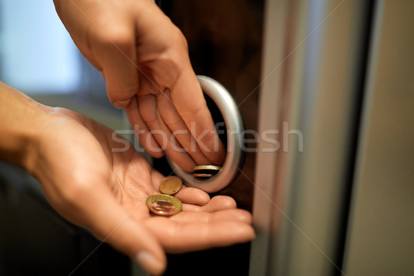 hands with euro coins at vending machine Stock photo © dolgachov