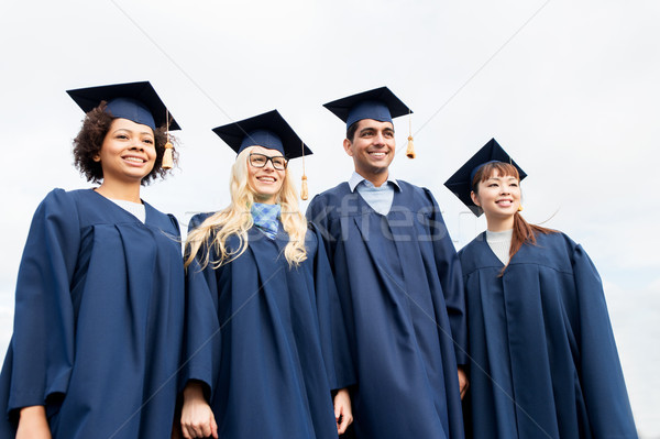 Feliz estudantes solteiros educação graduação pessoas Foto stock © dolgachov