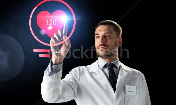 doctor or scientist with heart rate projection Stock photo © dolgachov