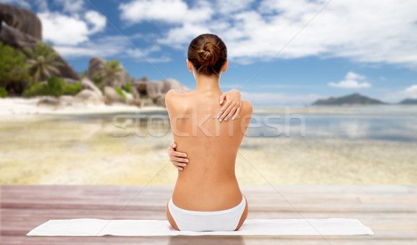 beautiful woman with bare top on beach Stock photo © dolgachov