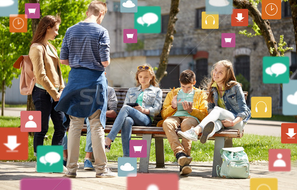 teenage students with tablet pc at school yard Stock photo © dolgachov