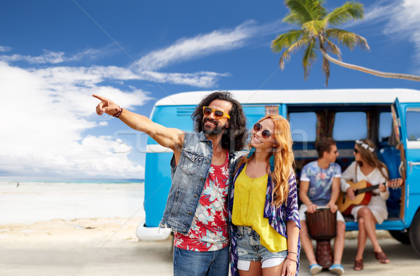 happy hippie couples and minivan on beach Stock photo © dolgachov