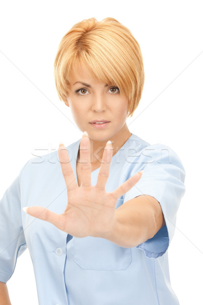 Stock photo: attractive female doctor showing stop gesture