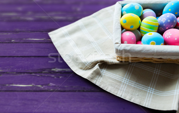 Közelkép színes húsvéti tojások kosár húsvét ünnepek Stock fotó © dolgachov