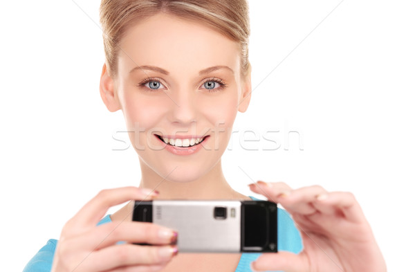 Stock photo: happy woman using phone camera