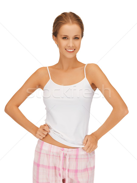 happy and smiling woman in cotton pajamas Stock photo © dolgachov