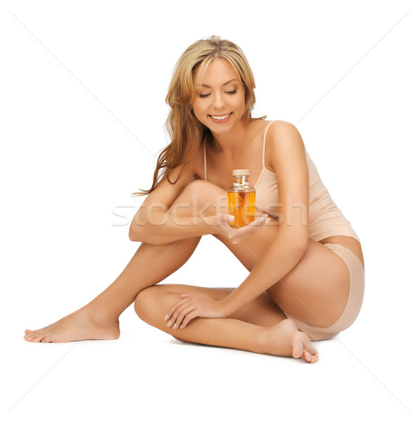 Kobieta bawełny oleju butelki zdjęcie ciało Zdjęcia stock © dolgachov