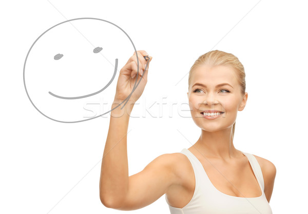 Stock photo: woman drawing happy face