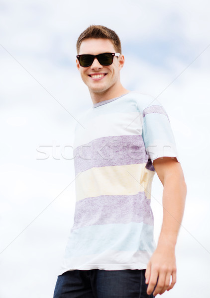 man in shades outside Stock photo © dolgachov
