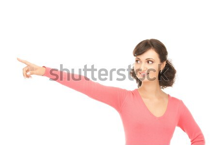 smiling teenager pointing her finger up Stock photo © dolgachov