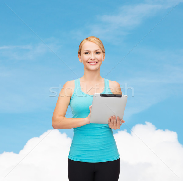 Stock photo: sporty woman with tablet pc