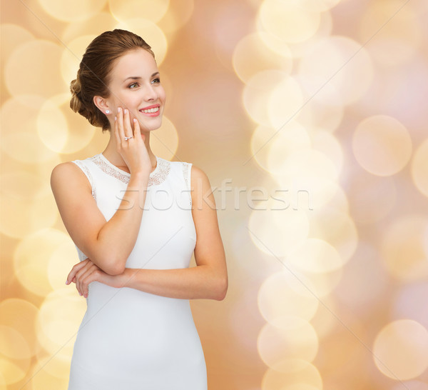 улыбающаяся женщина белое платье кольцо с бриллиантом праздников празднования Сток-фото © dolgachov