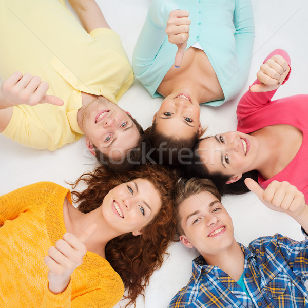 group of smiling teenagers Stock photo © dolgachov