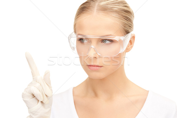 woman in protective glasses and gloves Stock photo © dolgachov