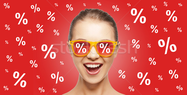 happy teenage girl in shades with percentage signs Stock photo © dolgachov