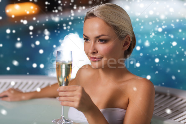 happy woman drinking champagne at swimming pool Stock photo © dolgachov