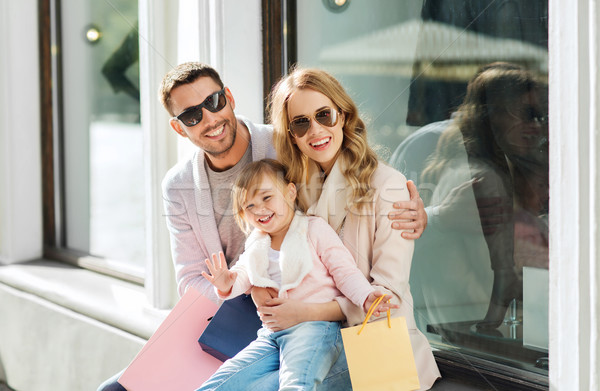 happy family with child and shopping bags in city Stock photo © dolgachov