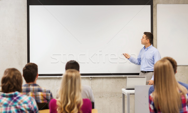 group of students and teacher in classroom Stock photo © dolgachov