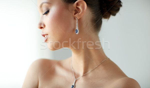 beautiful asian woman with earring and pendant Stock photo © dolgachov