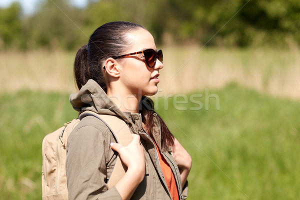 happy young woman with backpack hiking outdoors Stock photo © dolgachov