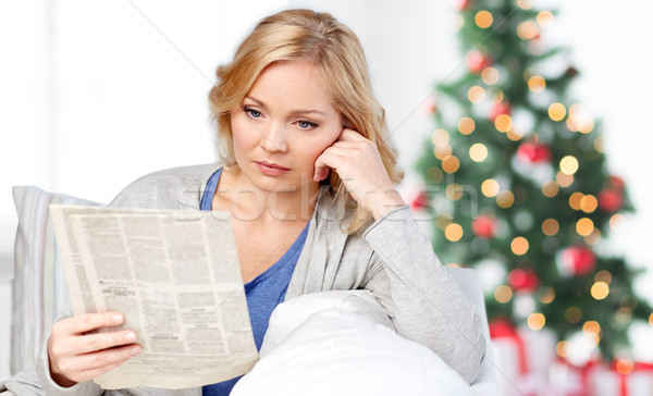 woman reading newspaper at christmas Stock photo © dolgachov