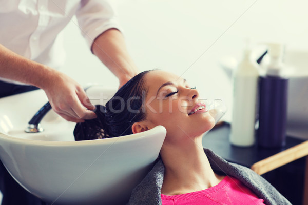 happy young woman at hair salon Stock photo © dolgachov