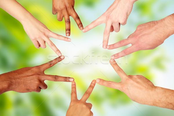 group of international people showing peace sign Stock photo © dolgachov