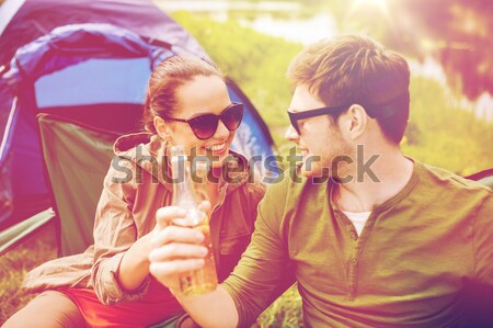 happy teenage couple looking at each other in park Stock photo © dolgachov