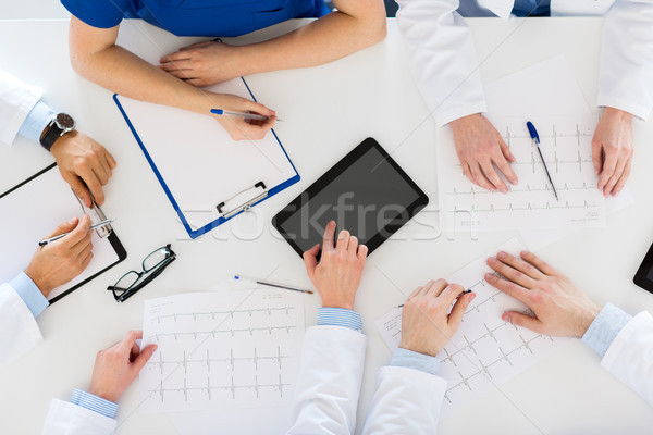 doctors with cardiograms and tablet pc at hospital Stock photo © dolgachov