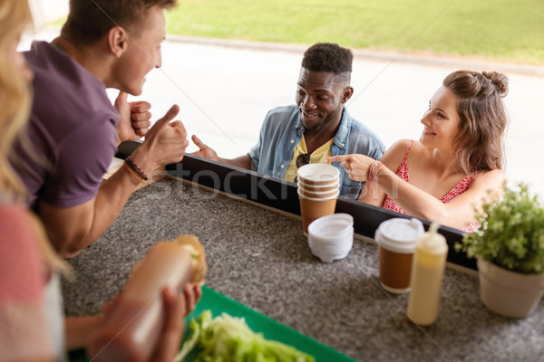 customers couple ordering something at food truck Stock photo © dolgachov
