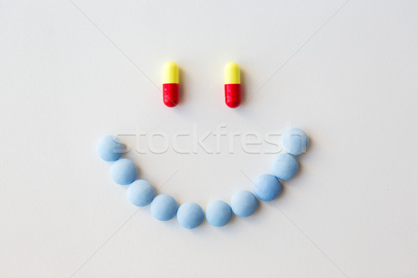 smiley of different pills and capsules of drugs Stock photo © dolgachov