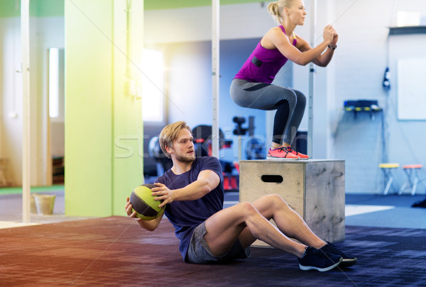 woman and man with medicine ball exercising in gym Stock photo © dolgachov