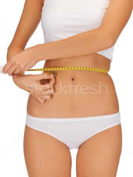 woman with measure tape Stock photo © dolgachov