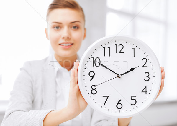 Atraente empresária branco relógio negócio escritório Foto stock © dolgachov