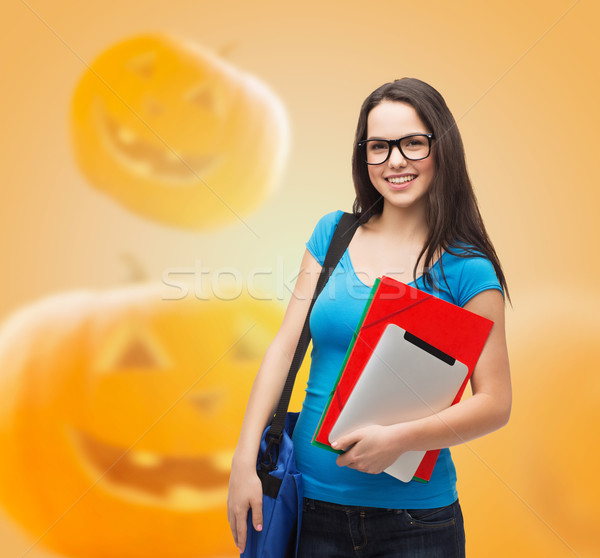 smiling student girl with books and bag Stock photo © dolgachov