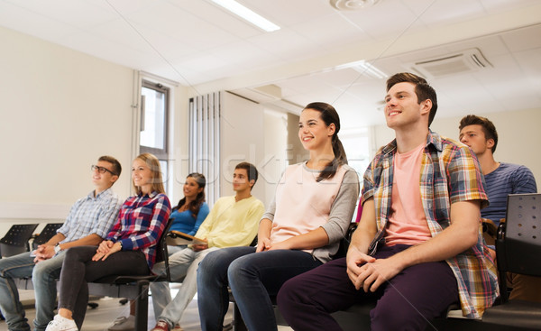 group of smiling students in lecture hall Stock photo © dolgachov