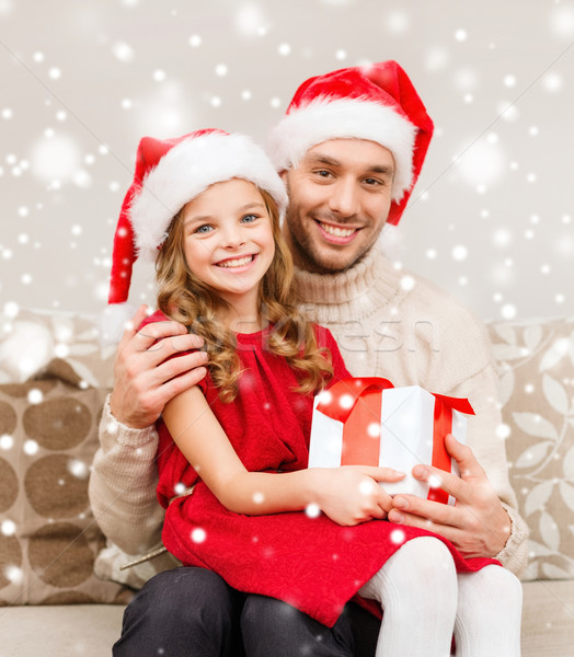 smiling father and daughter holding gift box Stock photo © dolgachov