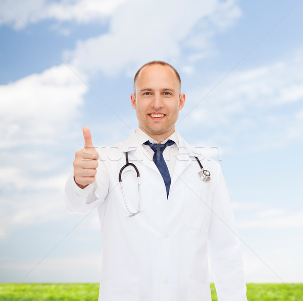 smiling doctor with stethoscope showing thumbs up Stock photo © dolgachov