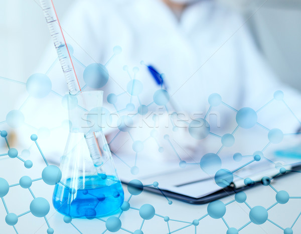 close up of scientist making test in laboratory Stock photo © dolgachov