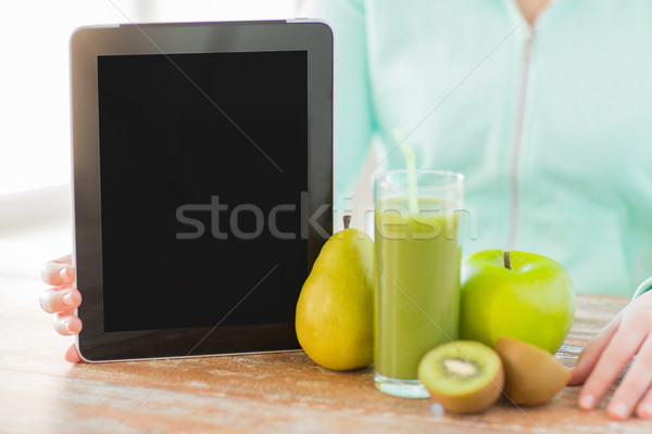 close up of woman hands tablet pc and fruit juice Stock photo © dolgachov