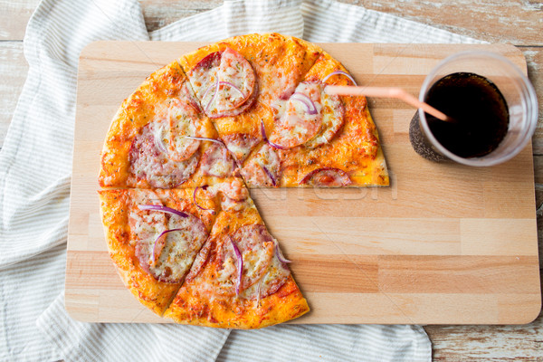 close up of pizza with coca cola on table Stock photo © dolgachov