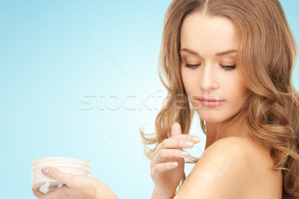 smiling woman cleaning face skin with cotton pad Stock photo © dolgachov